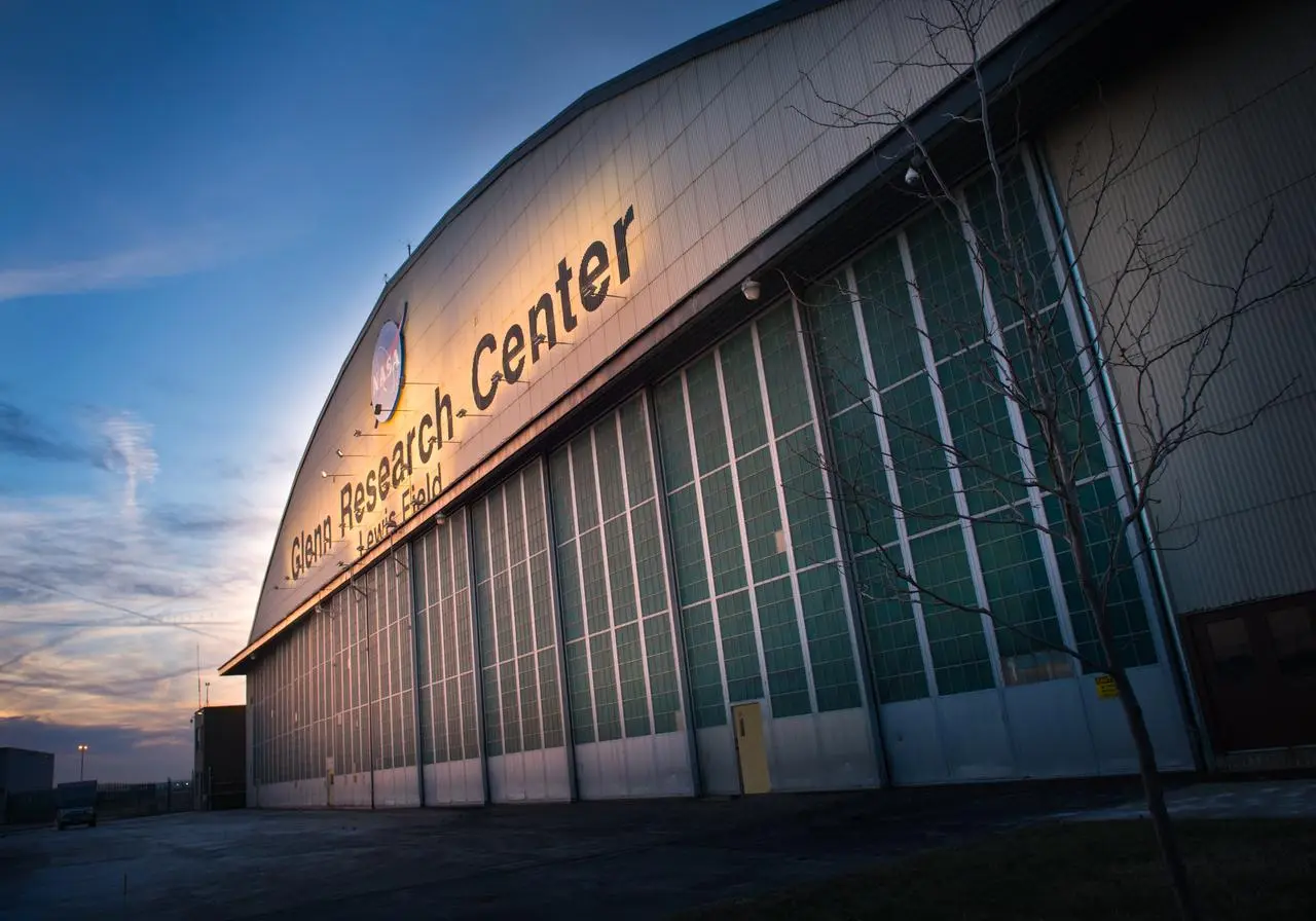 The Sun rises above the Flight Research Building at NASA’s Glenn Research Center in Cleveland. Credit: NASA